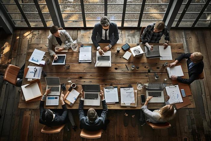 Business strategy and consulting team collaborating around a table